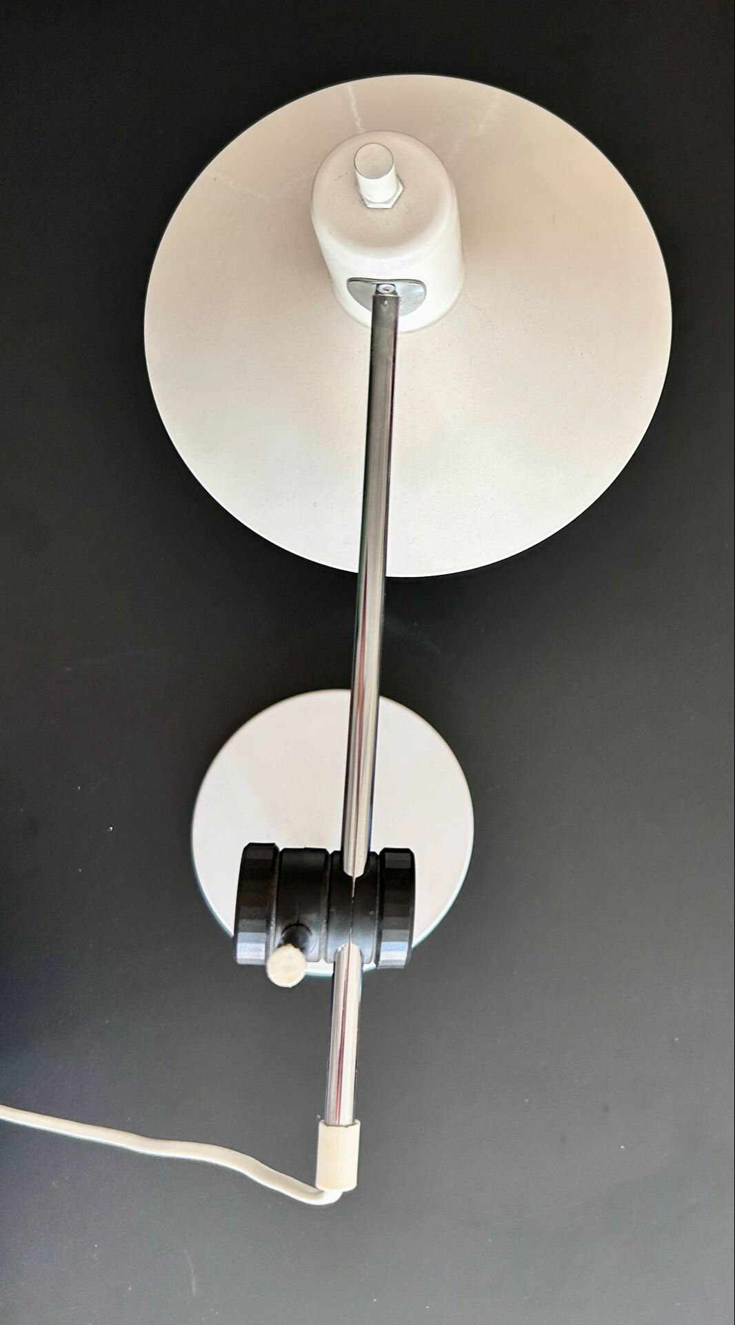 Articulated lamp in white colour.