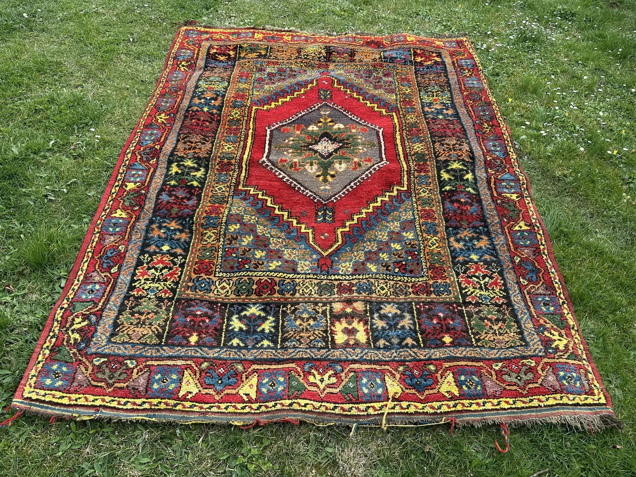 Old Moroccan carpet, made of natural wool and handwoven.