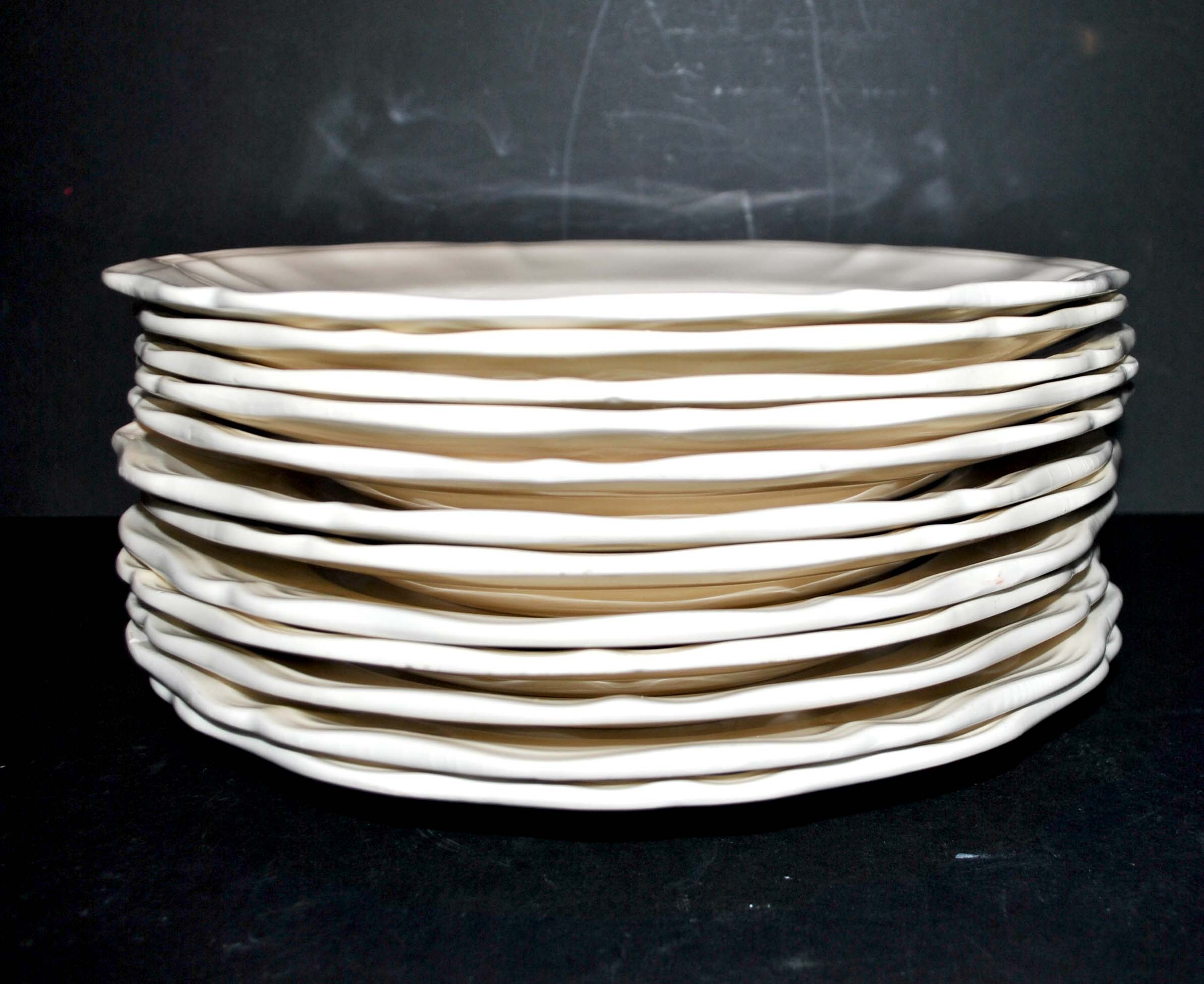 Sarreguemines series of 12 flat plates in opaque faience cream "terre de fer"