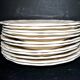 Sarreguemines series of 12 flat plates in opaque faience cream "terre de fer"