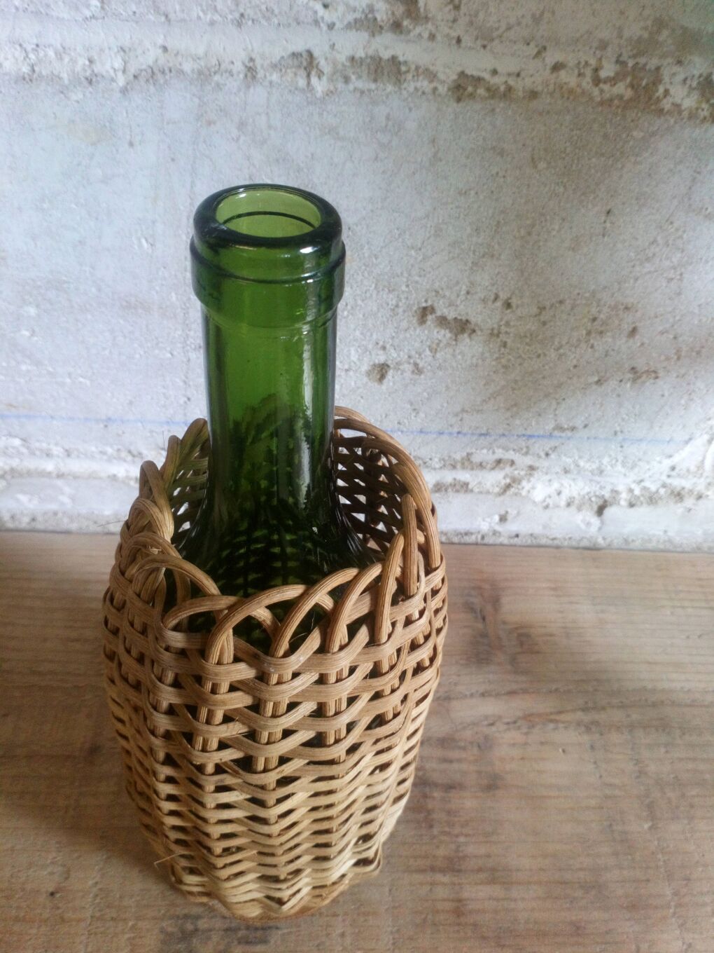 Bottle in a rattan basketry 50s