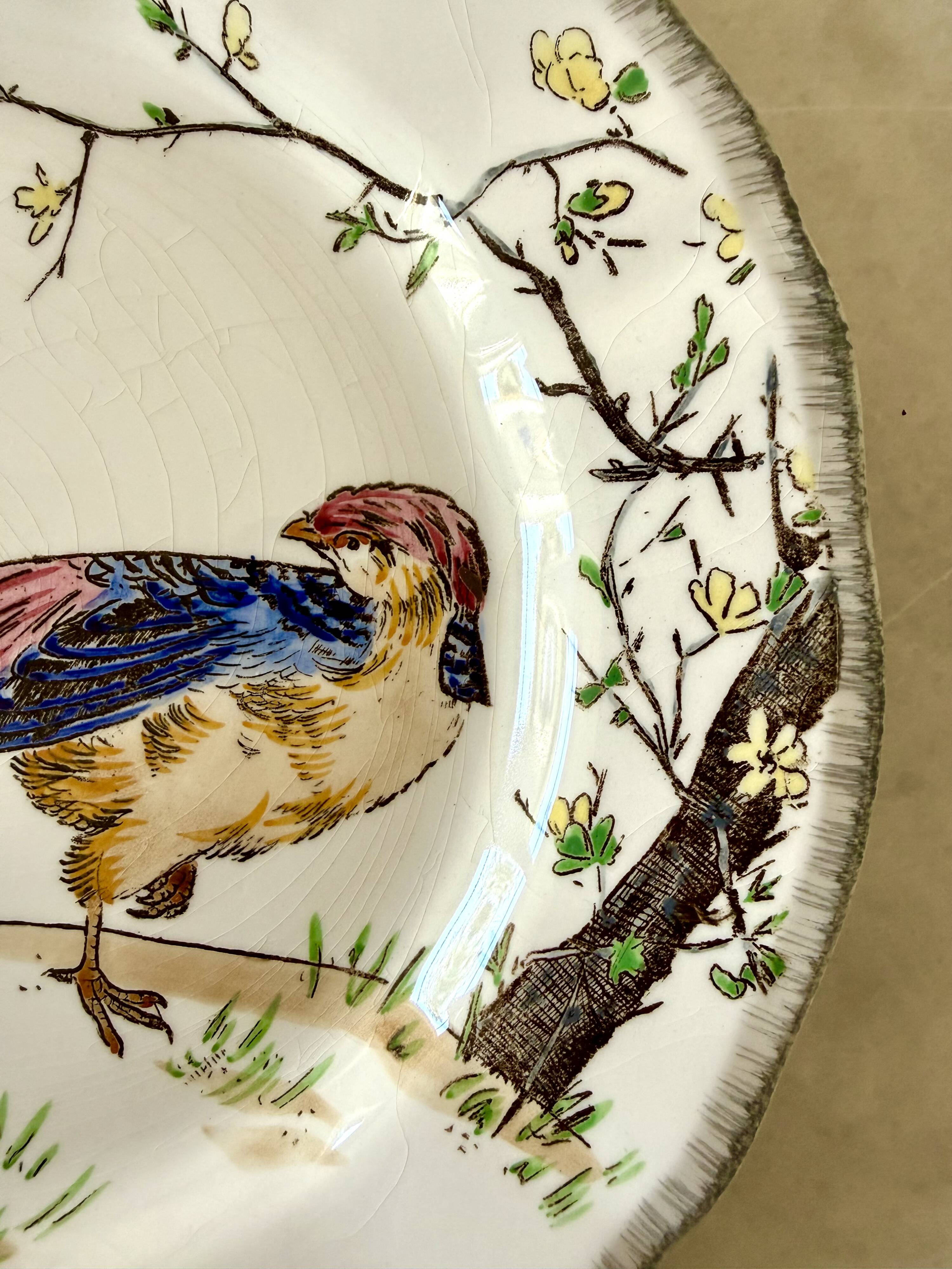 Service de table assiettes et plats Gien modèle grands oiseaux
