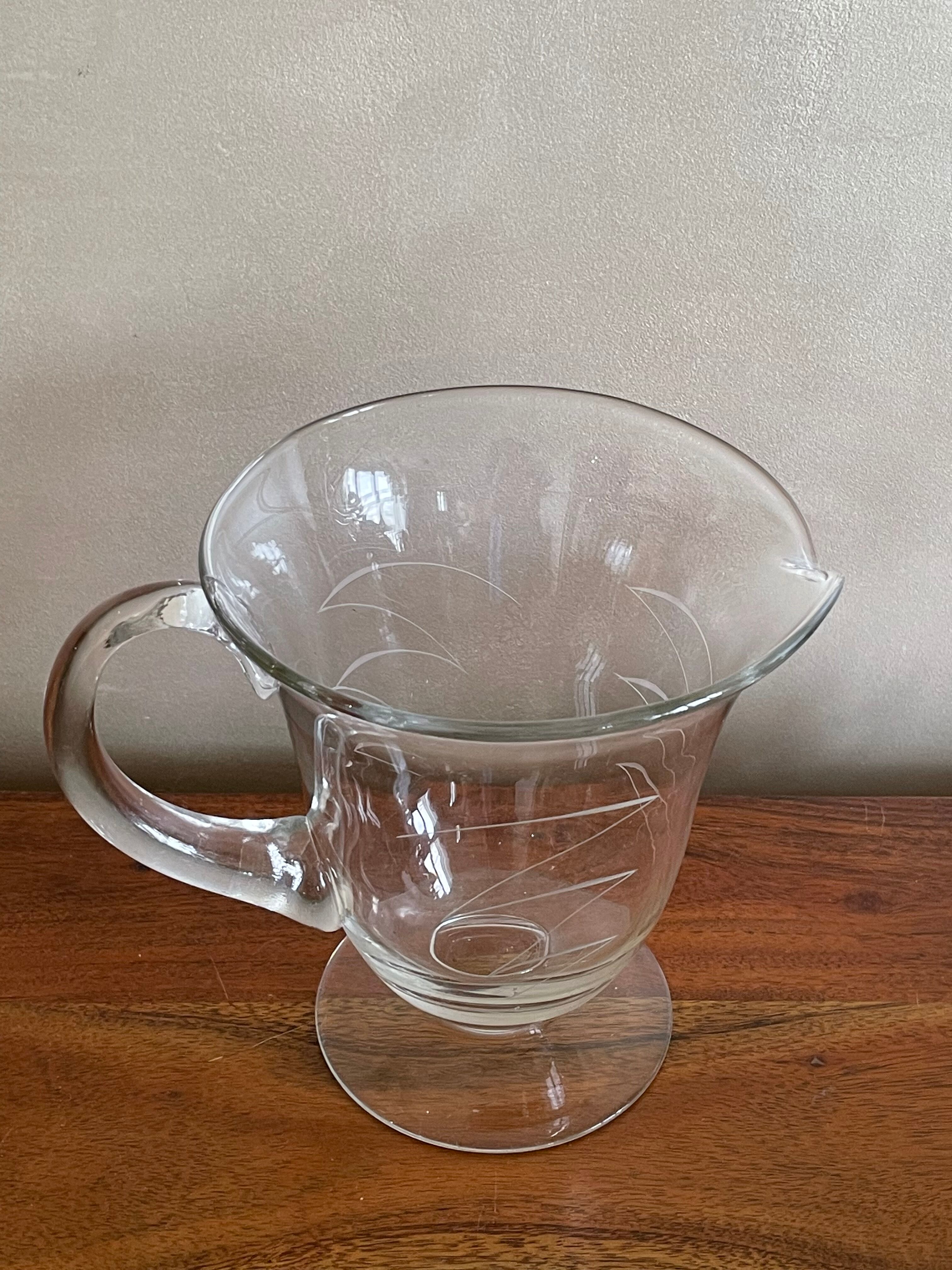 Engraved glass pitcher