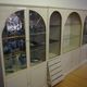 Showcases in lacquered wood, glass and brass  1970s, set of 4