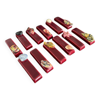 Set of vintage red ceramic knife holders, marine motif, retro style