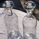 Two antique engraved glass bottles