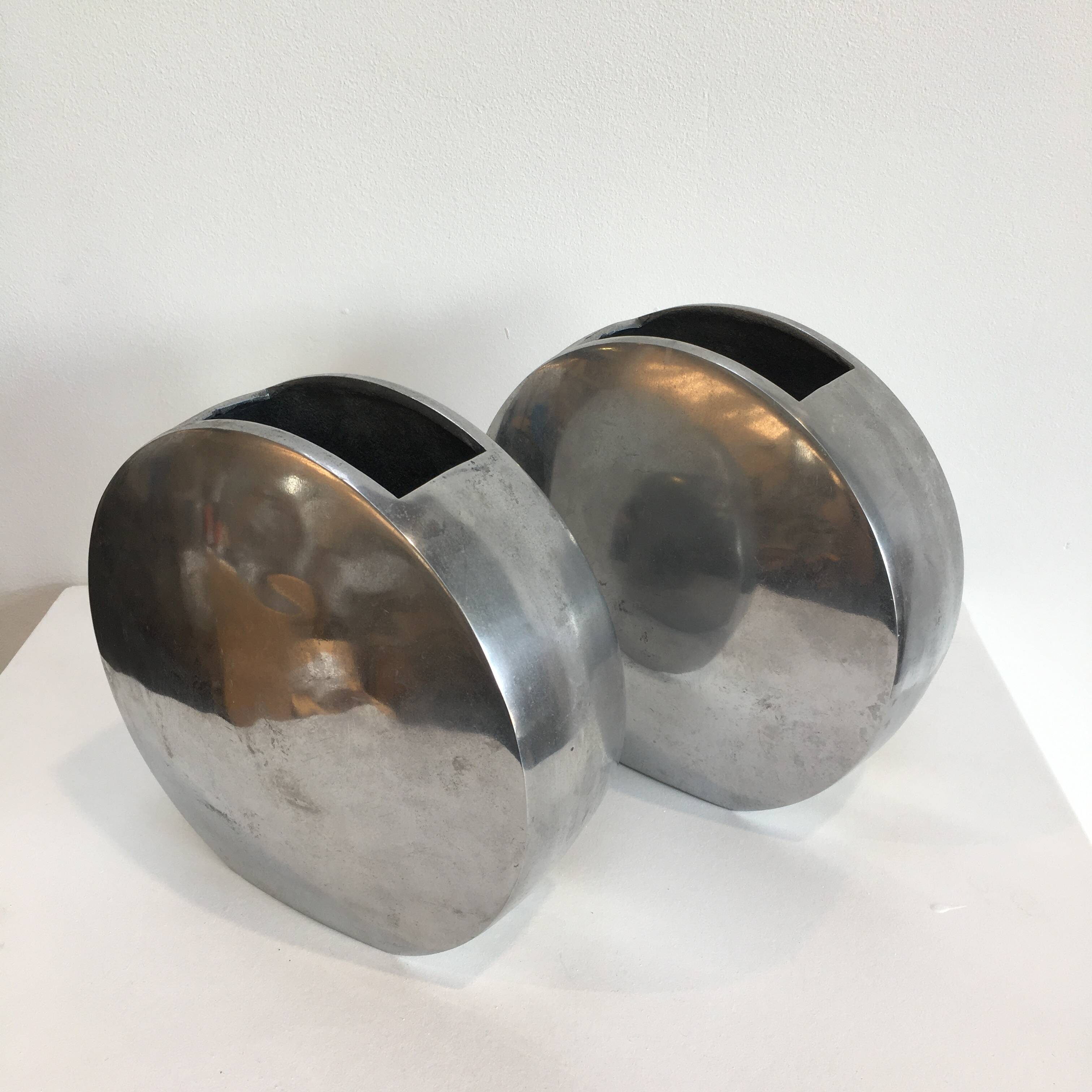 Series of two 70s style aluminum vases