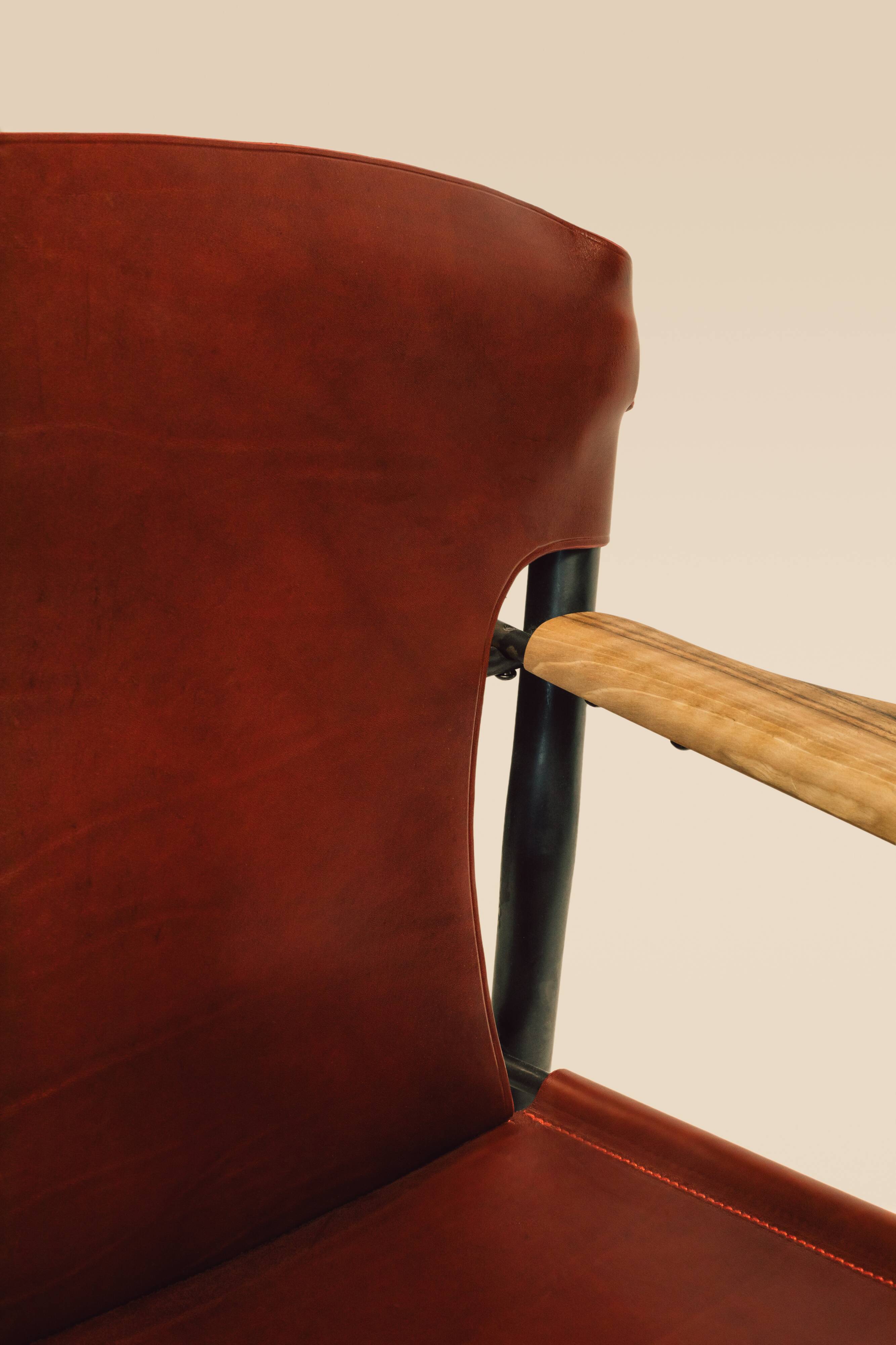 Maërl armchair, Galathée model, red leather, solid wood armrests of your choice