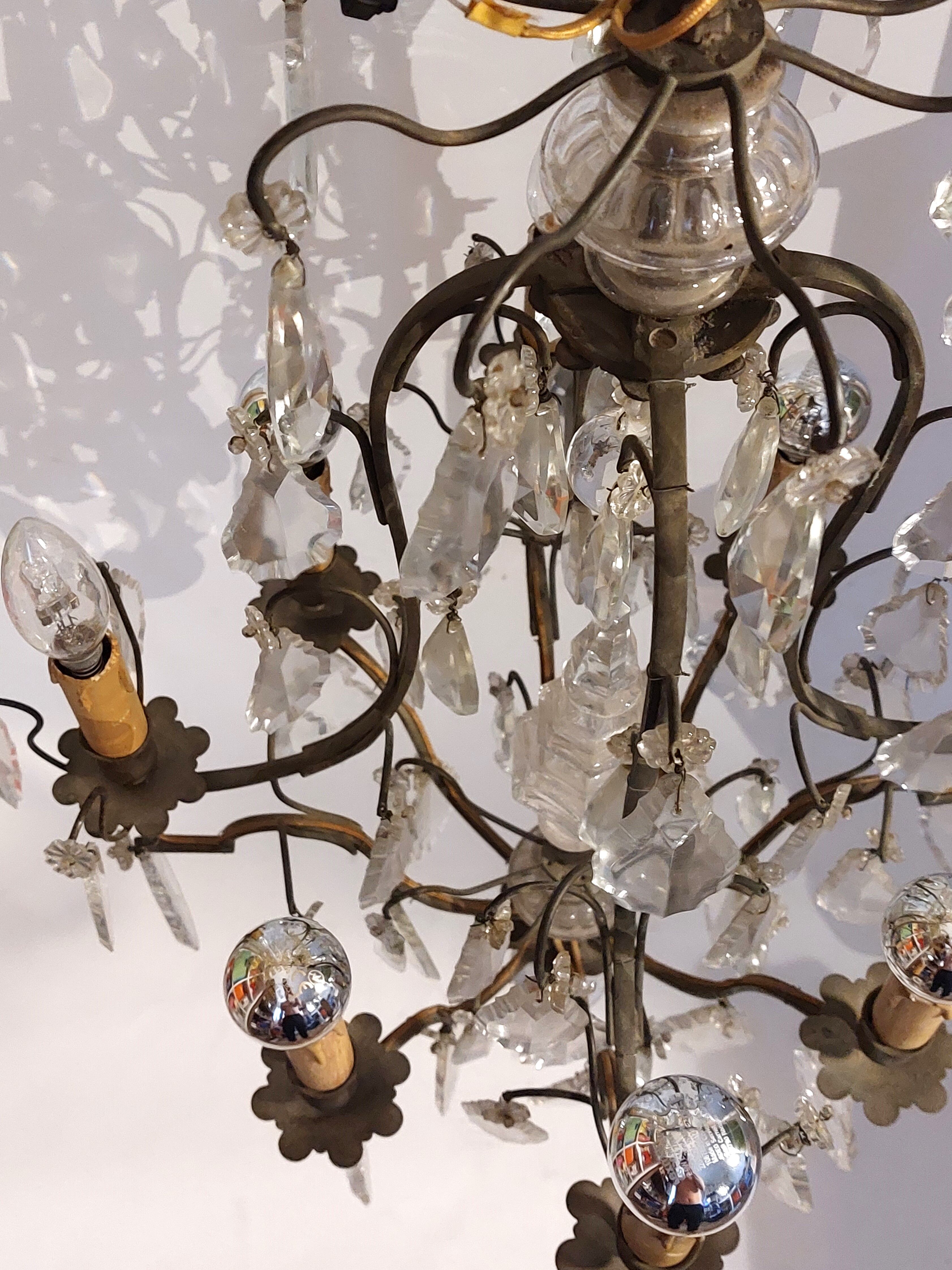 Neoclassical bronze chandelier with 8 lights, tassels and dagger
