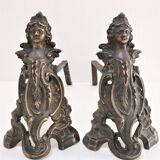 Pair of bronze andirons with black patina, 19th century, female caryatids