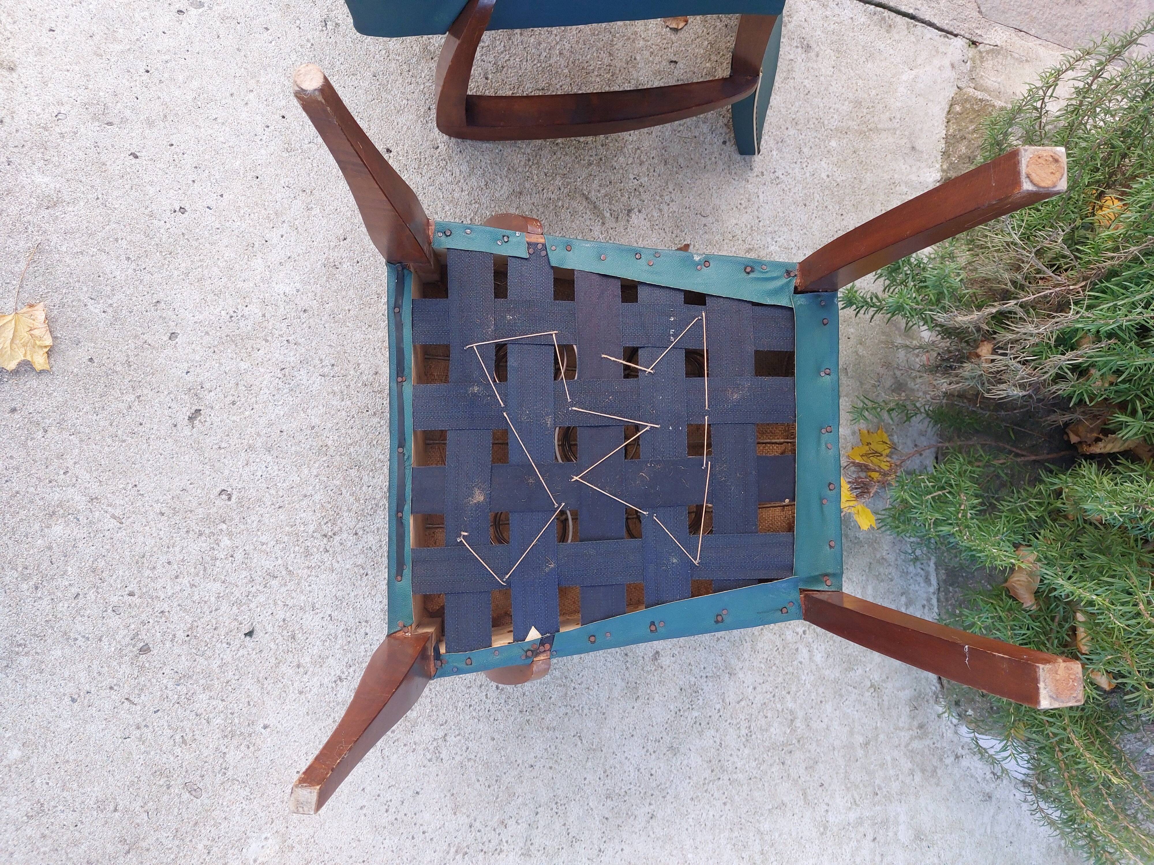 pair of dark green bridge armchairs