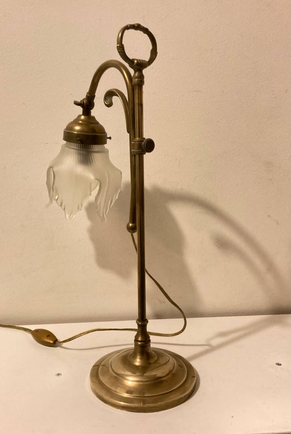 Brass table lamp with a glass shade
