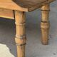 Brown Indonesian teak coffee table, with a border and cylindrical legs H40 L103.