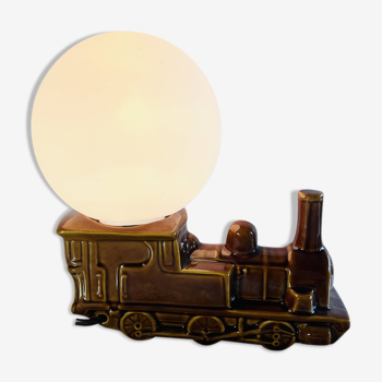 Vintage decorative lamp in the shape of a ceramic train.