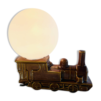 Vintage decorative lamp in the shape of a ceramic train.