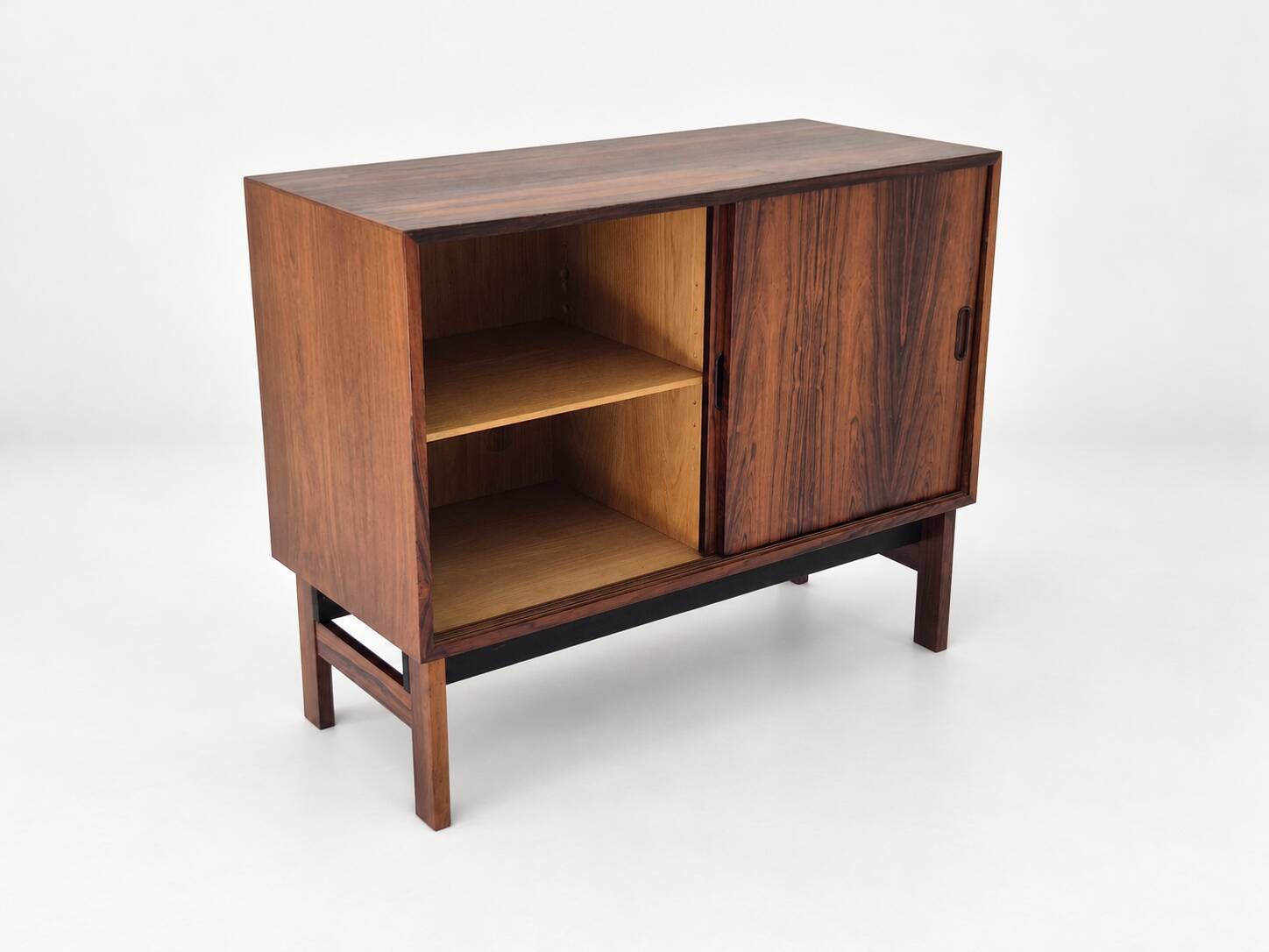 Low sideboard in rosewood with sliding doors. Denmark, 1960s