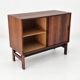Low sideboard in rosewood with sliding doors. Denmark, 1960s