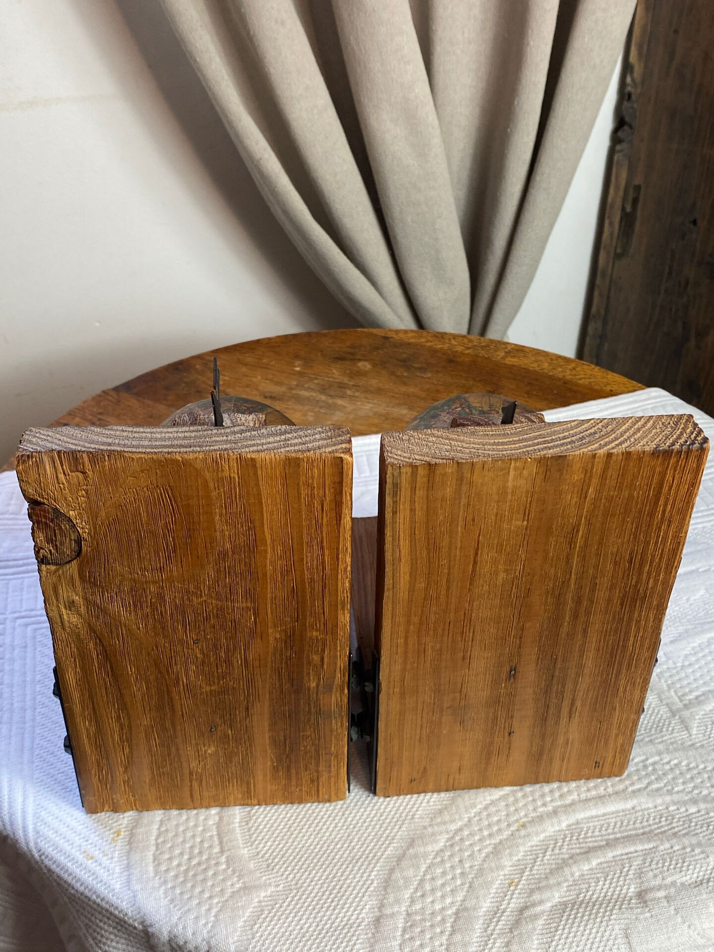 Pair of wooden bookends, rotating globes