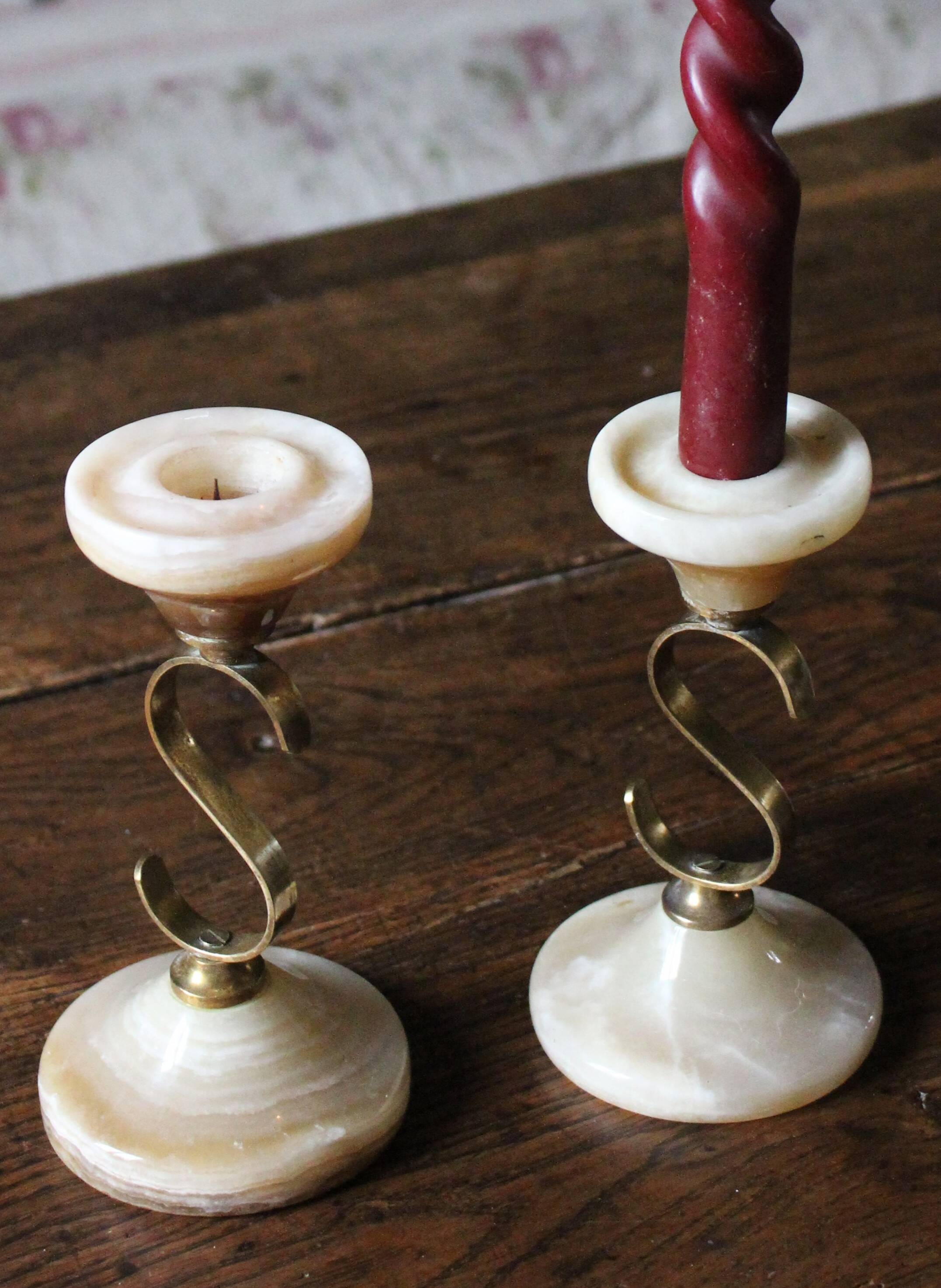 Pair of curved brass candlesticks with onyx