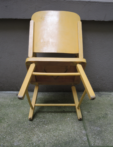 Children's chair in yellow wood