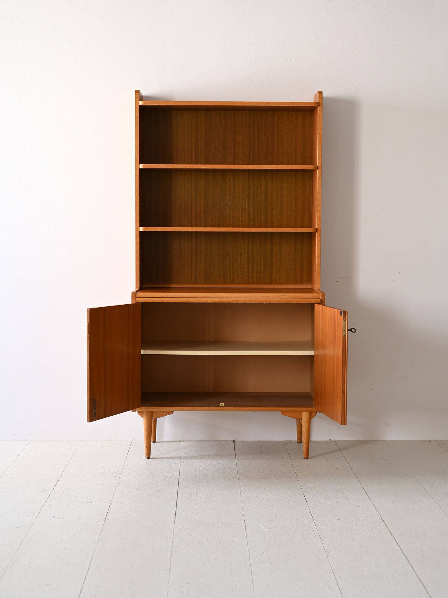 Vintage bookcase with pull-out shelf