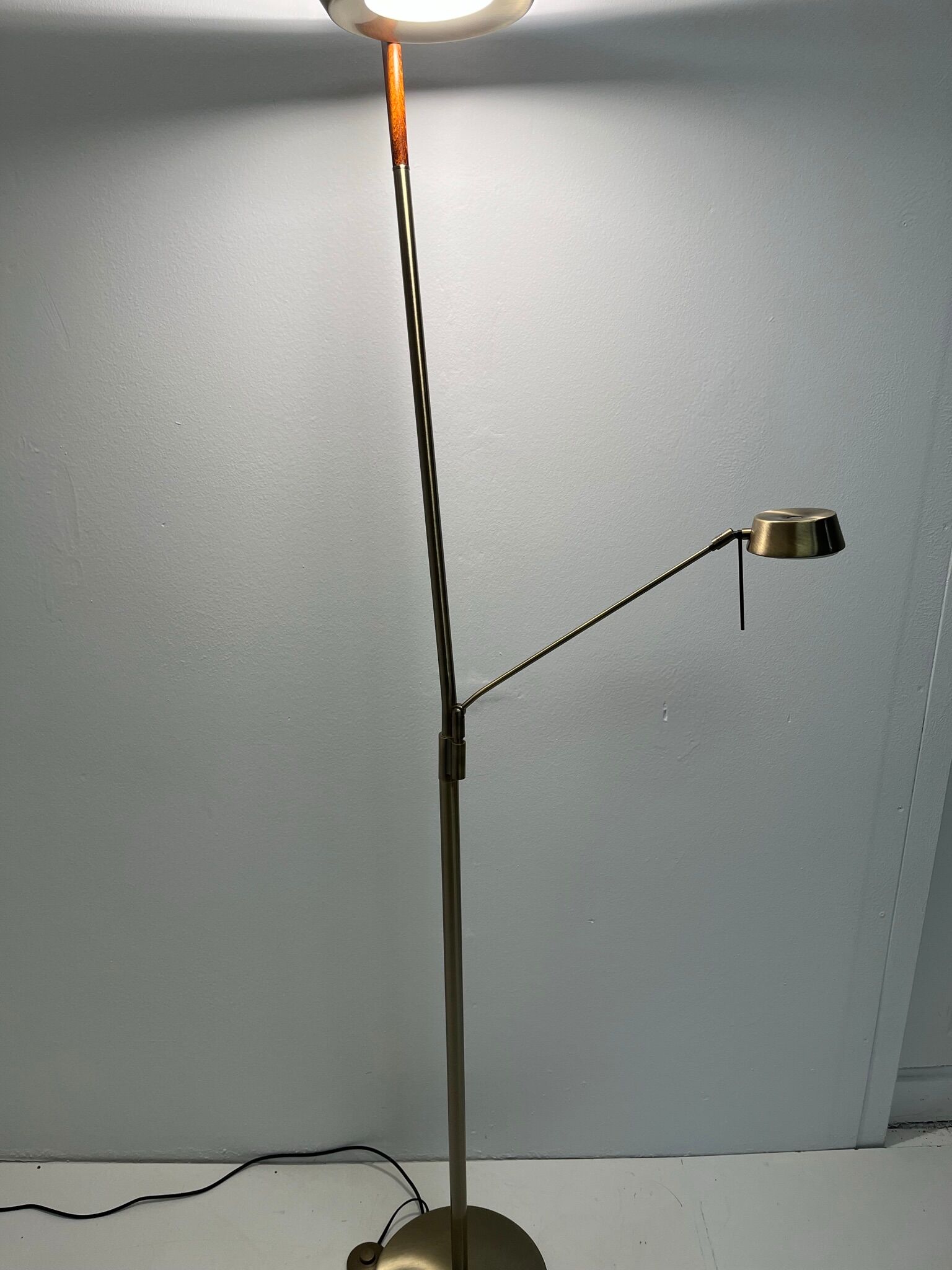 Golden metal floor lamp with reading light