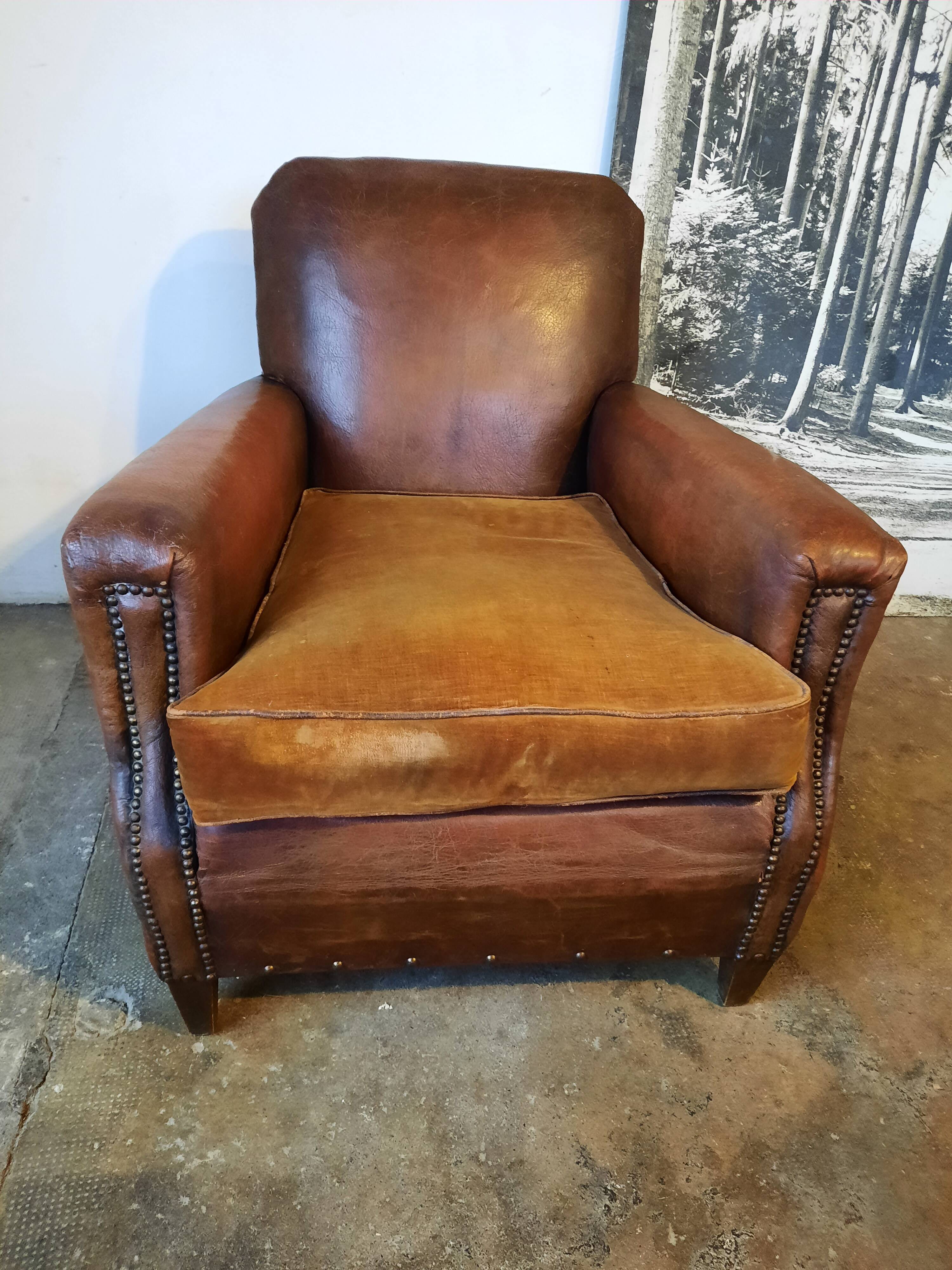 Old studded leather club chair 1930-1930