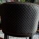 Pair of Art Deco barrel chairs in black and bronze