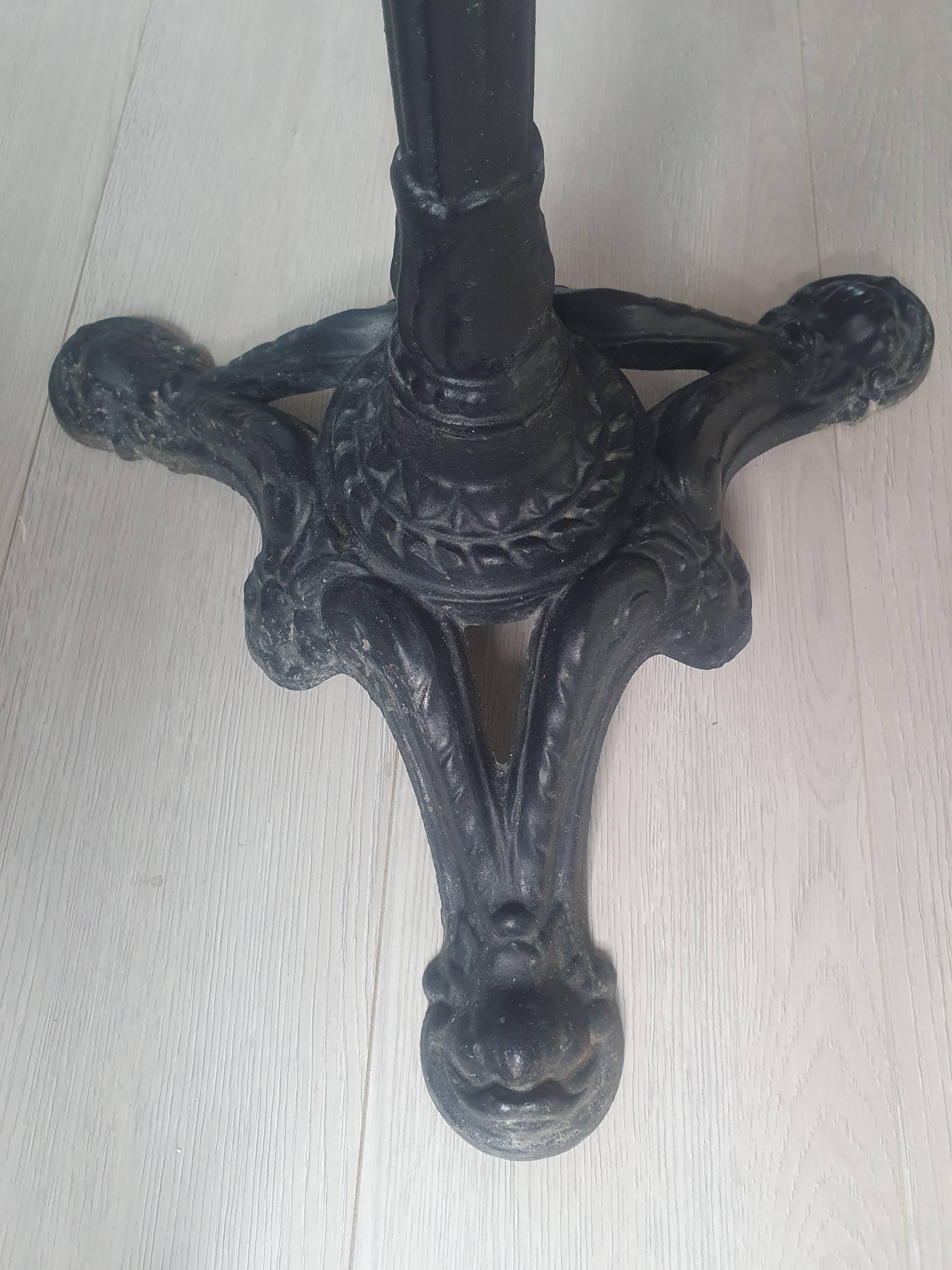 Genuine round bistro table, cast iron legs, brass rim