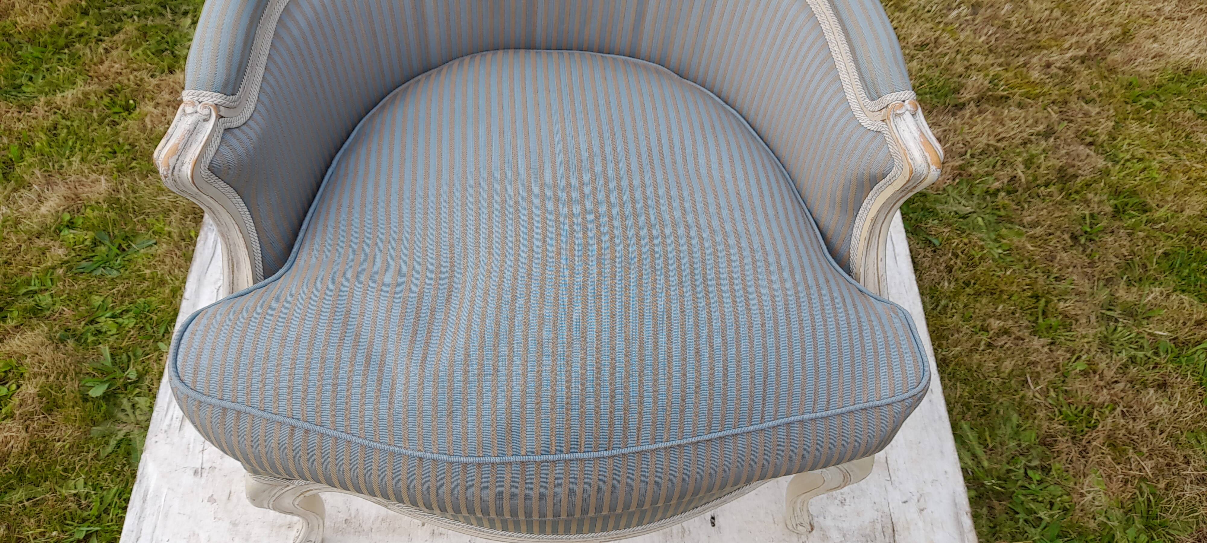 Bergère armchair with blue striped seat and back