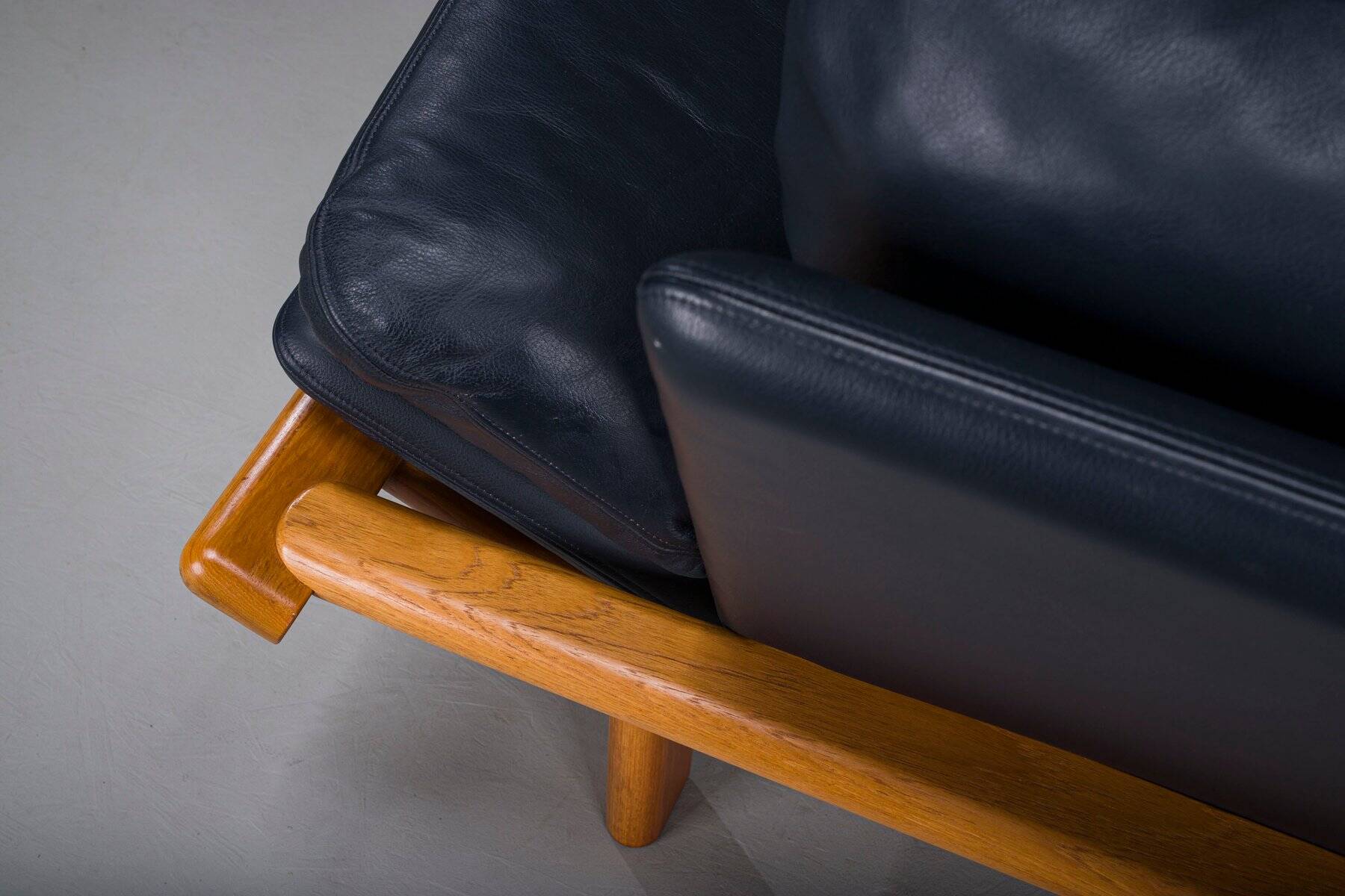 Danish teak and navy blue leather 2-seater sofa from Komfort, 1970s