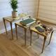 Set of 3 vintage nesting tables in onyx and gold metal from the 1970s.