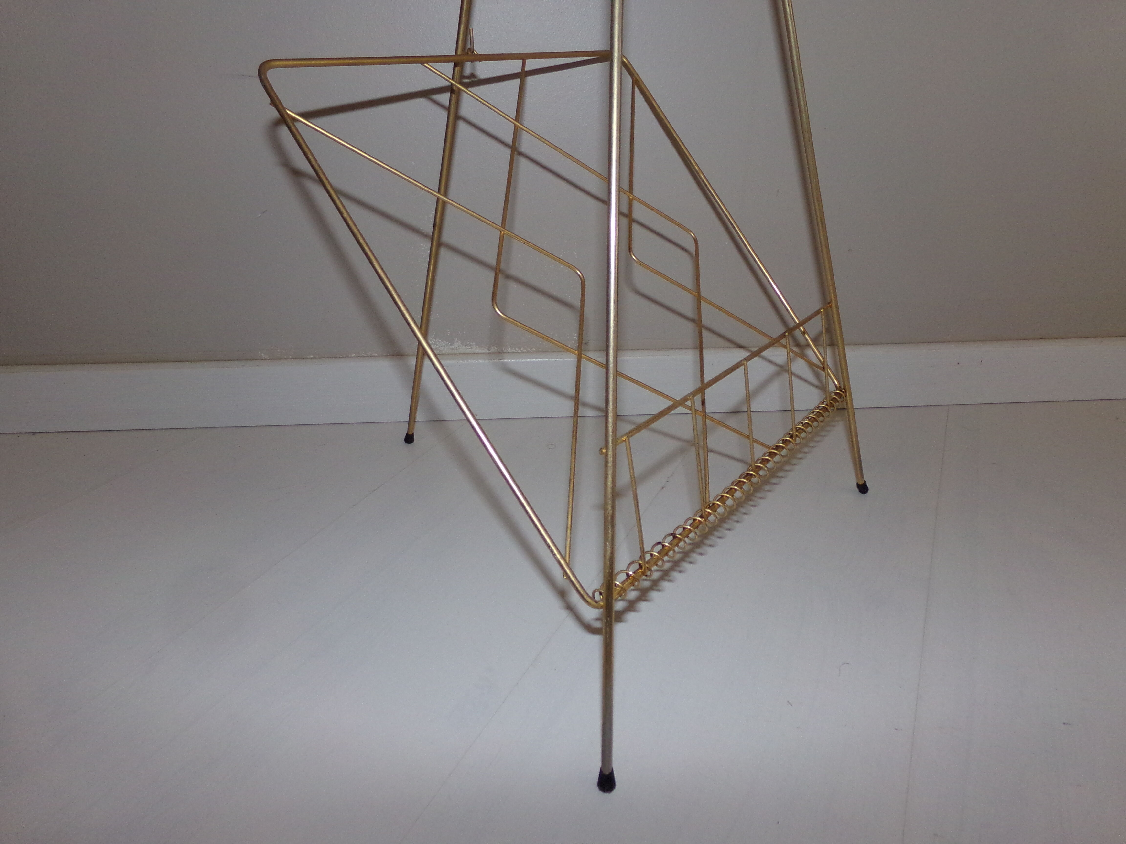 Vintage magazine holder in gold metal