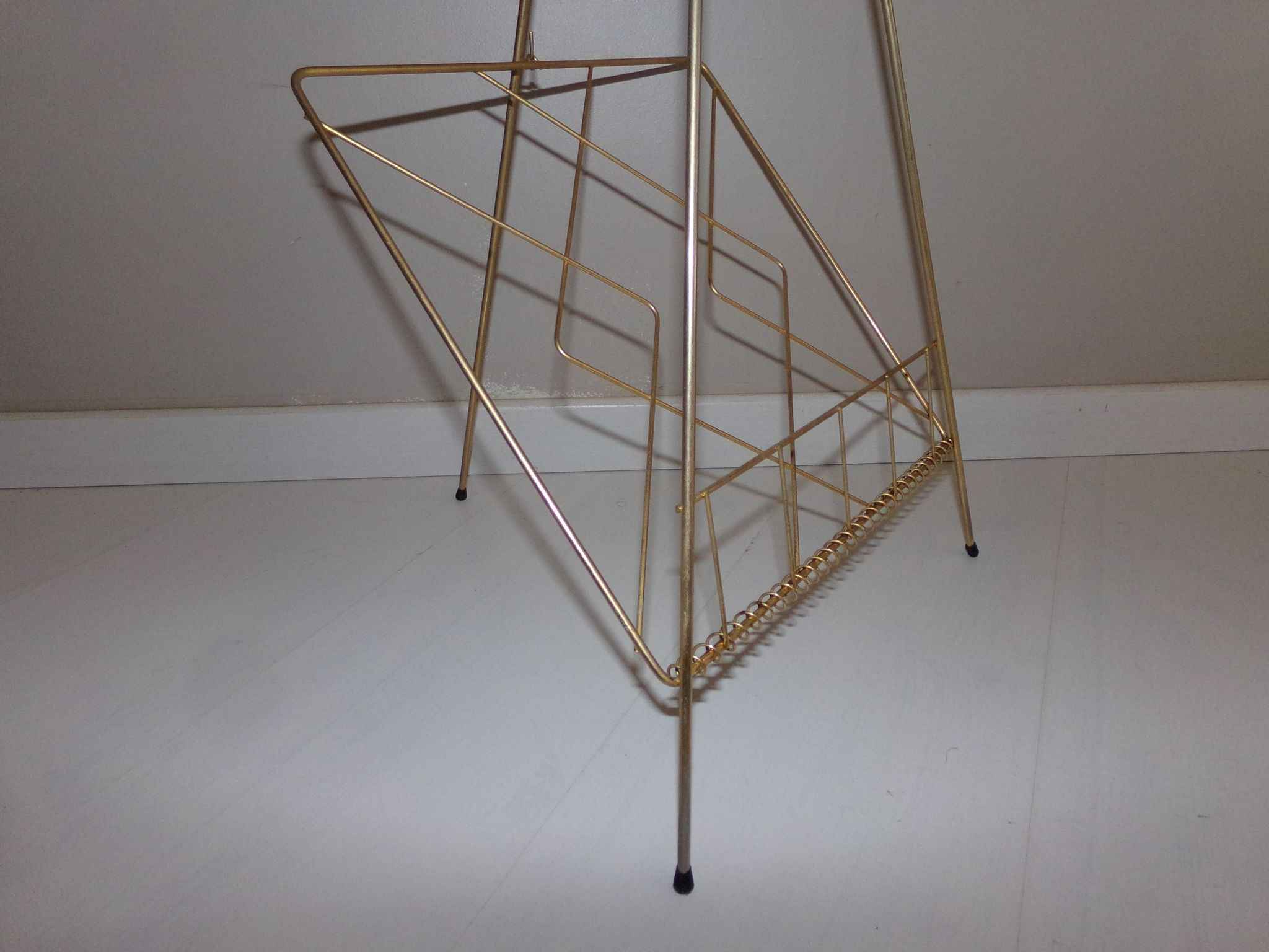 Vintage magazine holder in gold metal
