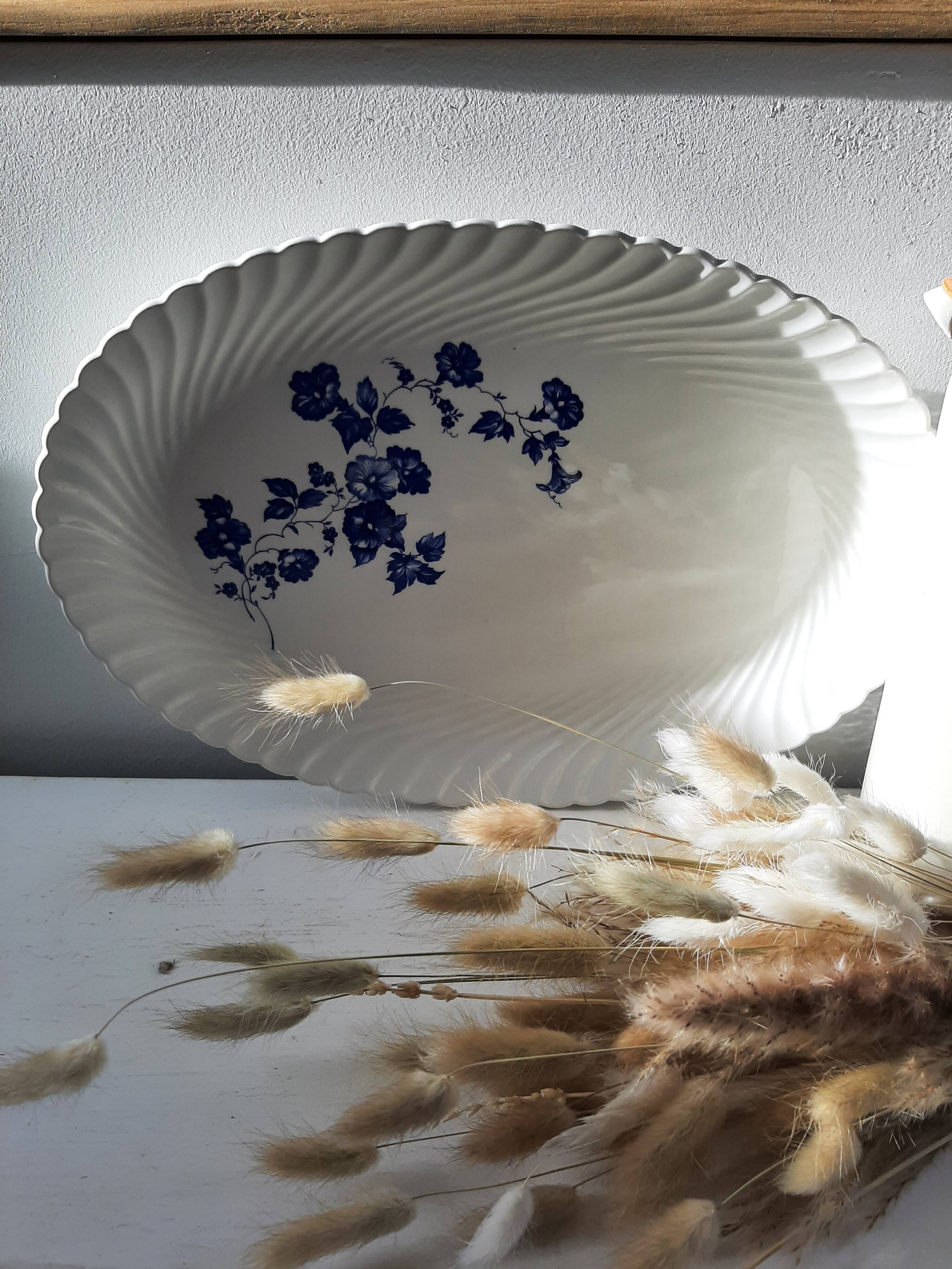 Keller and Guérin Lunéville serving dish with blue flowers on a white background.