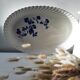 Keller and Guérin Lunéville serving dish with blue flowers on a white background.