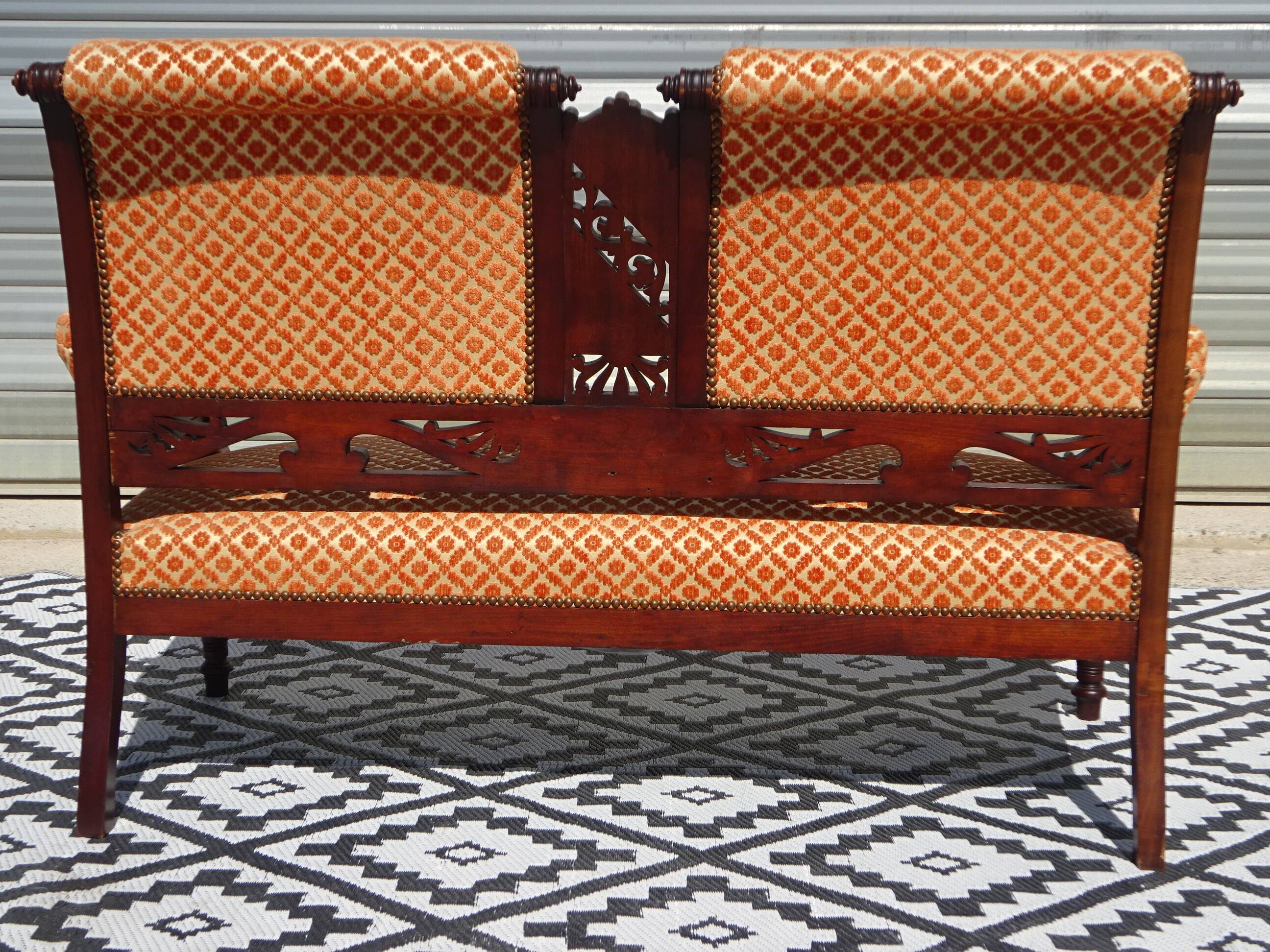 Vintage bench in wood and orange/ivory velvet.