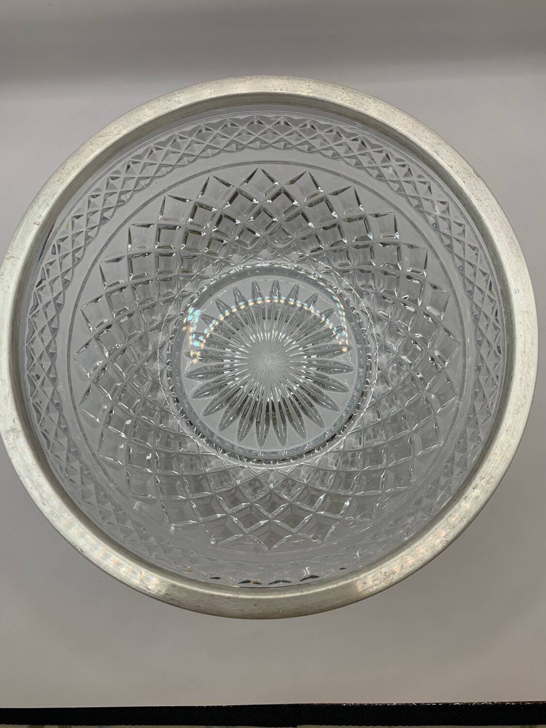 Chiseled glass (crystal?) salad bowl with silver metal edge