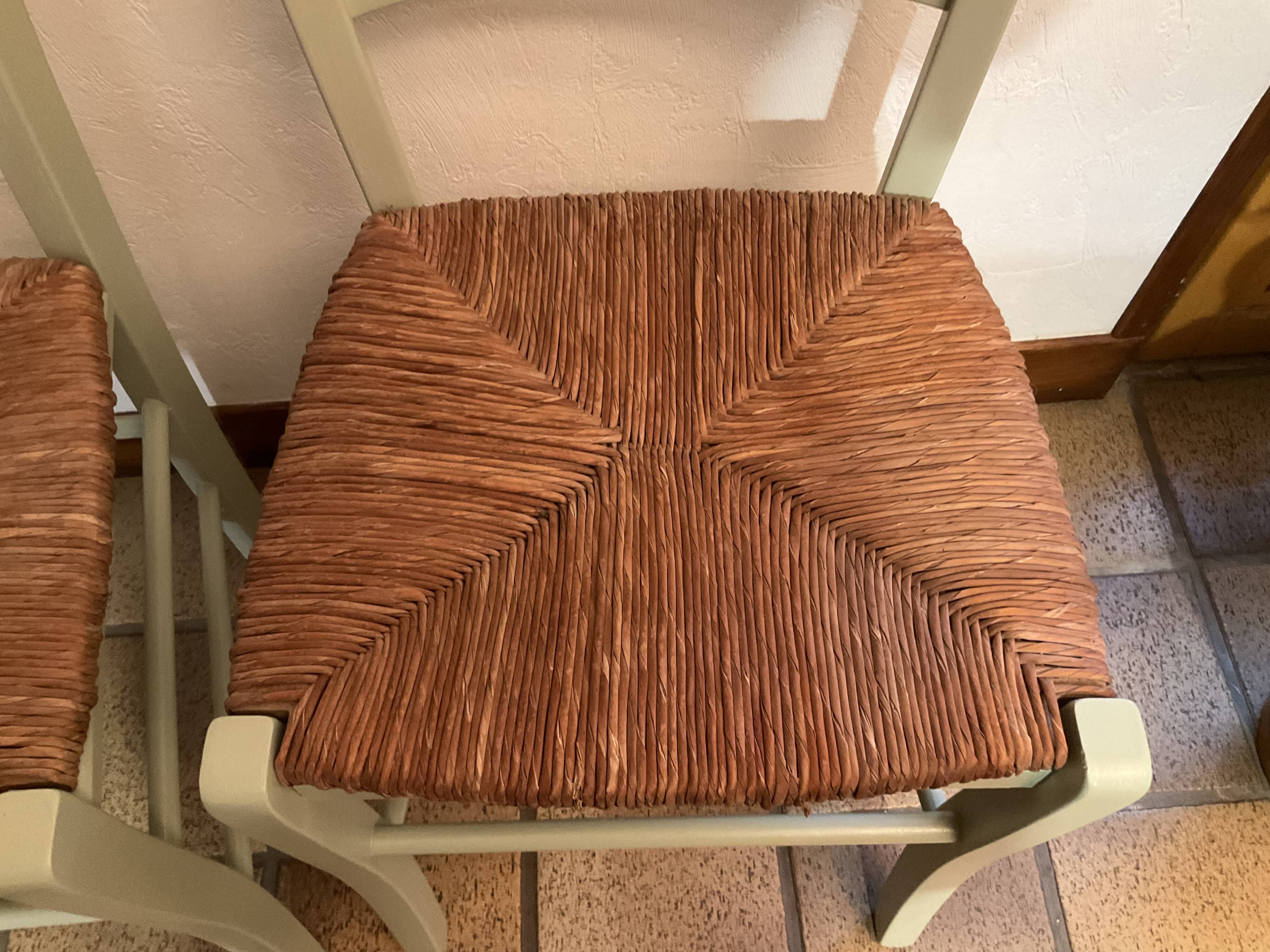 Pair of green straw chairs