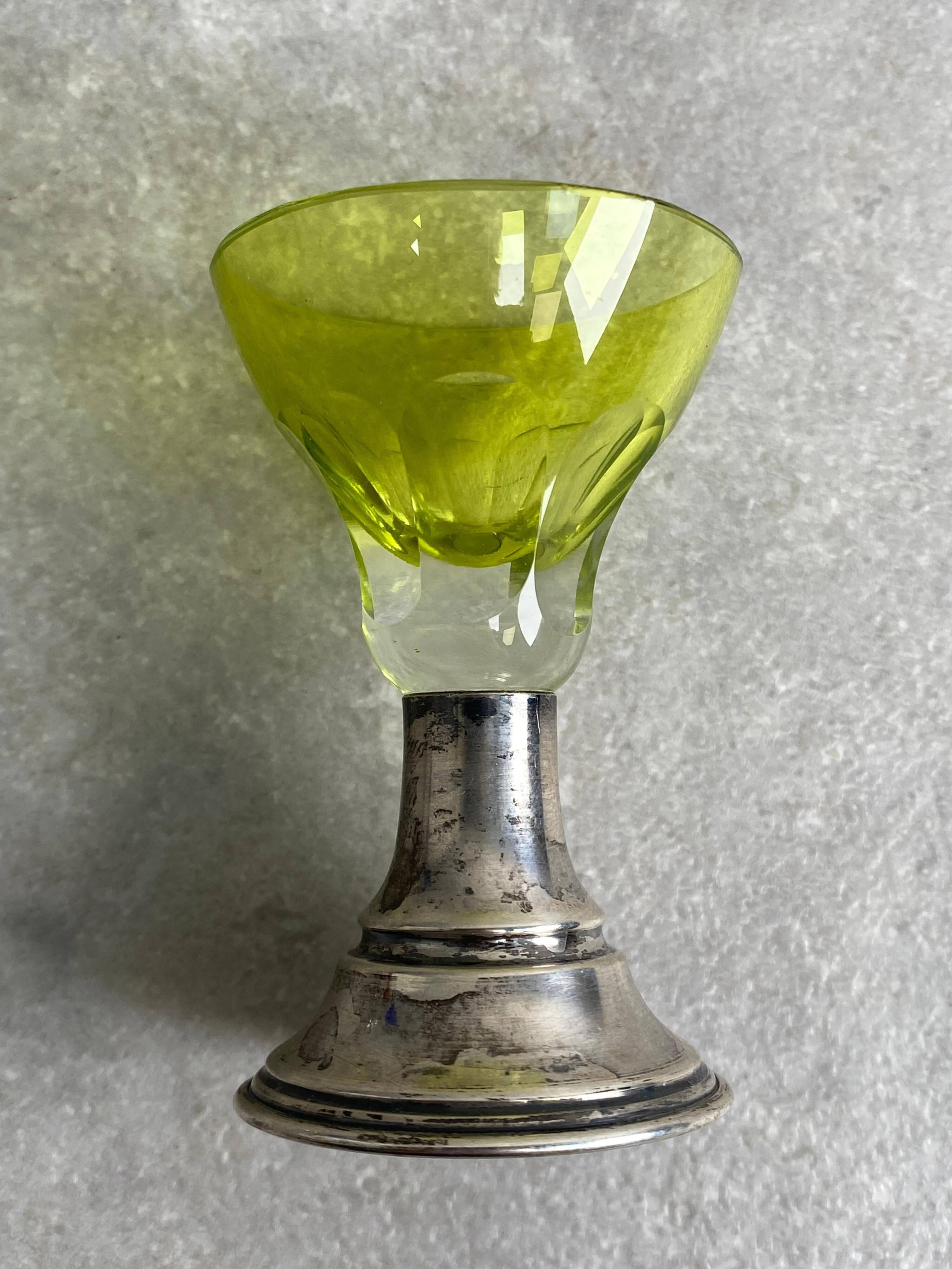 Set of 5 coloured stemmed glasses on silver stems.