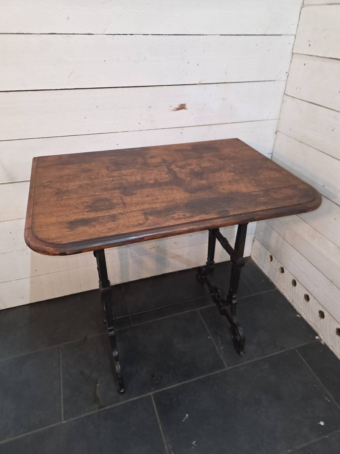 Bistro table with cast iron legs and oak top