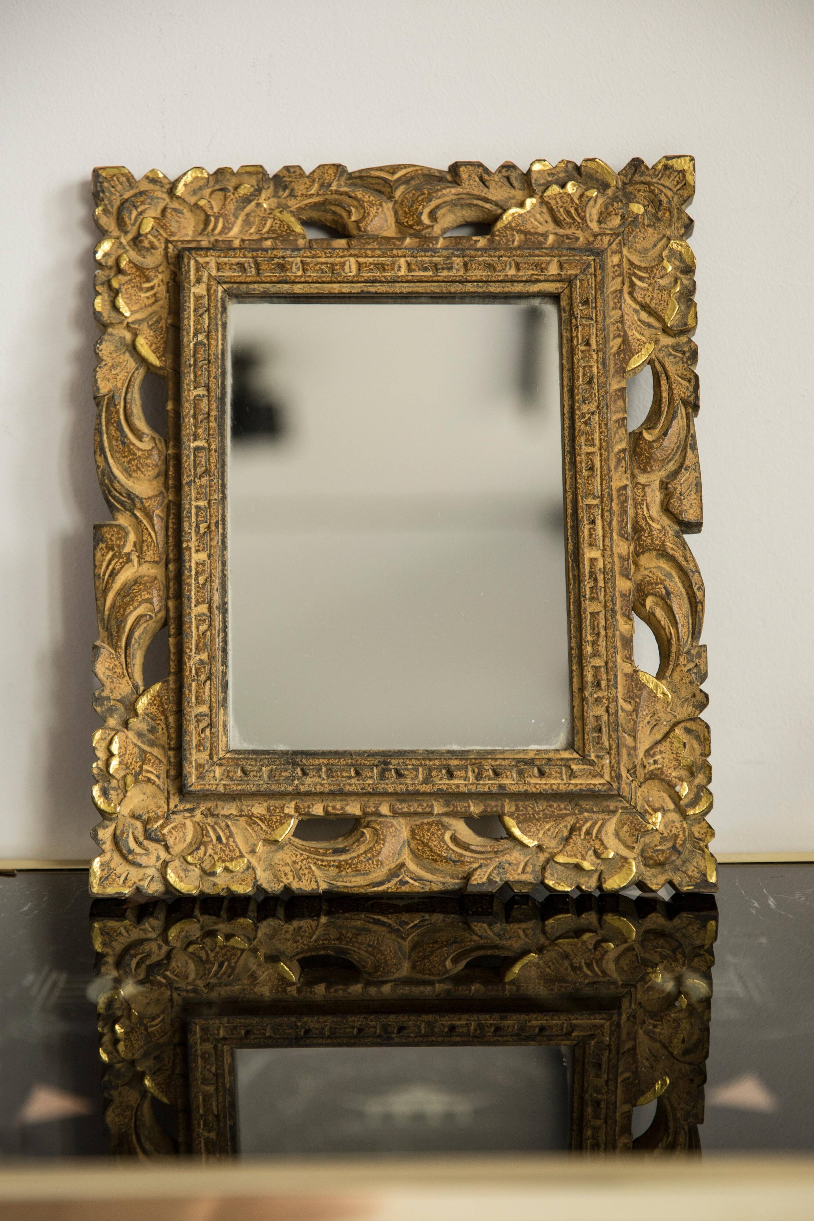 Decorative gold mirror mid-century in a wooden frame, Italy, 1960s.
