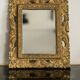 Decorative gold mirror mid-century in a wooden frame, Italy, 1960s.