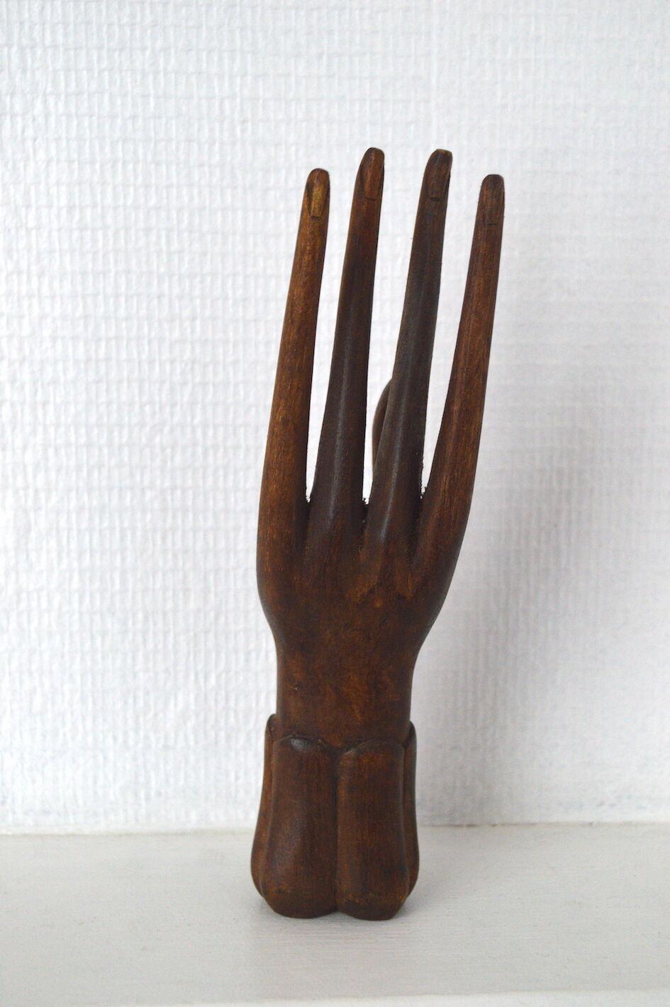 Carved wooden baguier hand