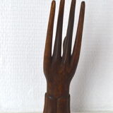 Carved wooden baguier hand