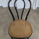 Chaise de salle à manger vintage style Thonet en bois noir et assise en cannage 1970