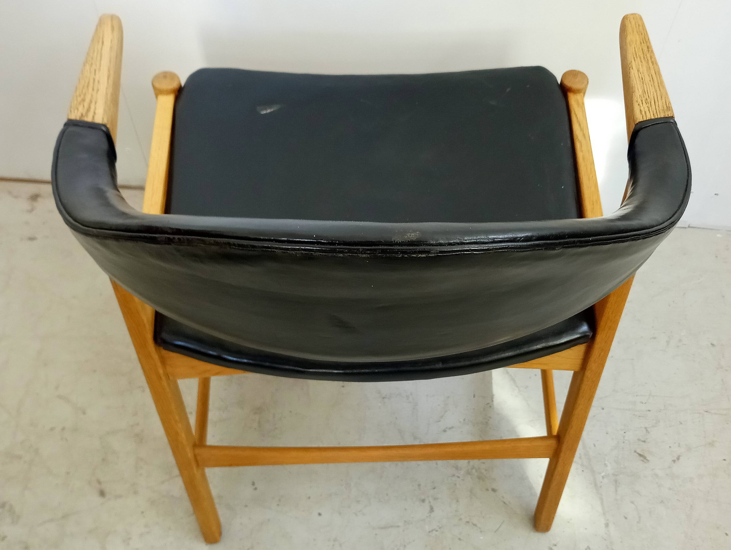 Danish armchair in oak and black leather