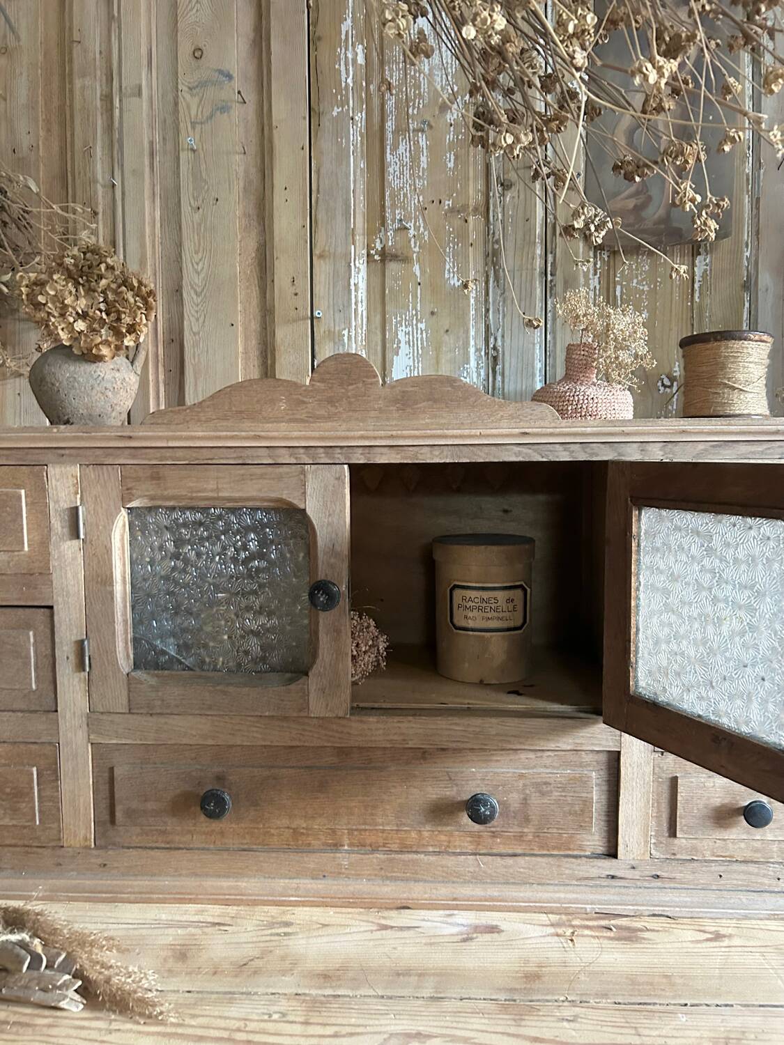 Small piece of furniture with glass doors and drawers