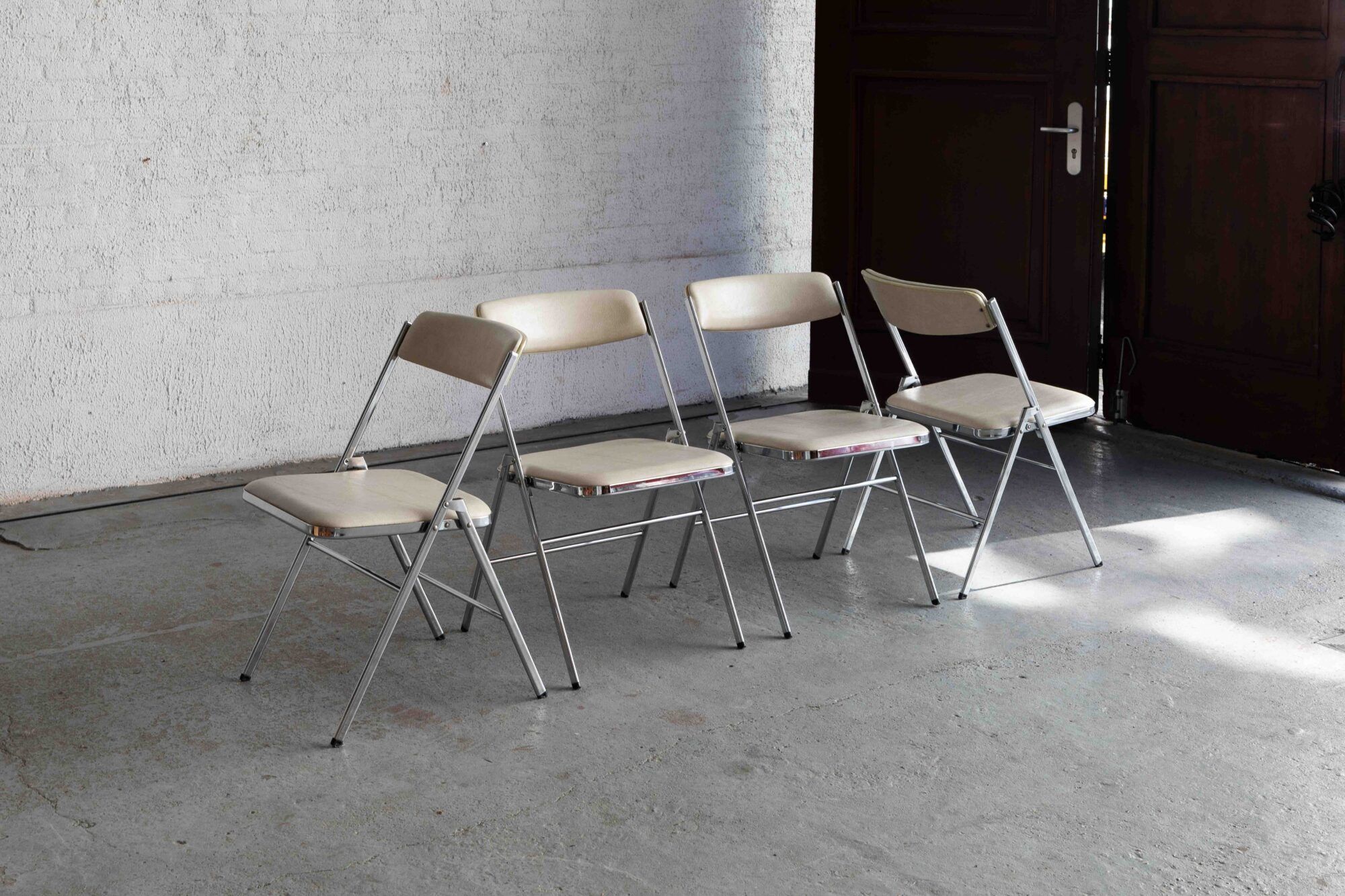 Set of 4 'Plia' dining chairs by Giancarlo Piretti