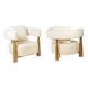 Pair of “bean” shaped armchairs, in blond beech. Contemporary work.